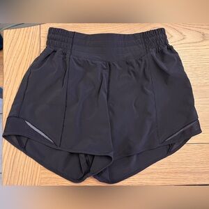 Women’s Lululemon hotty hot high rise 4” shorts in black.